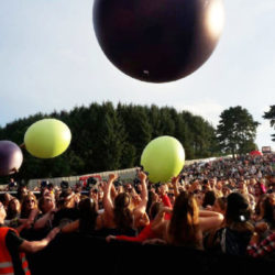 Vimto Advertising Inflatable Grapes In Festival Crowd