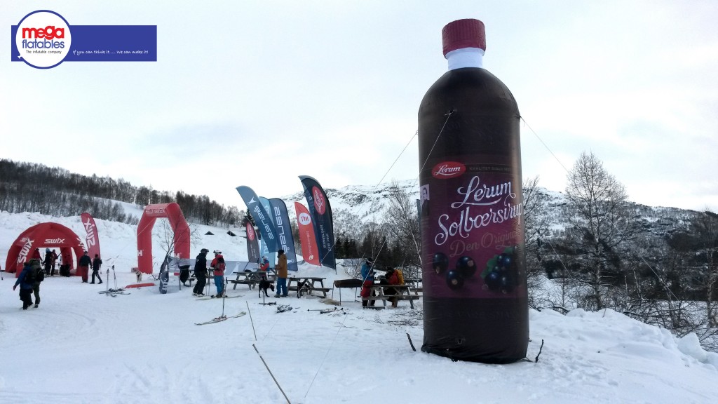 giant inflatable drinks bottle in snow