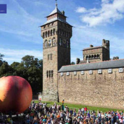 Giant Inflatable Peach outside of Castle