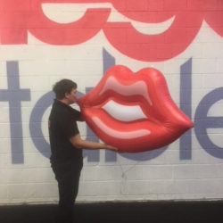 Man Holding Inflatable Lips