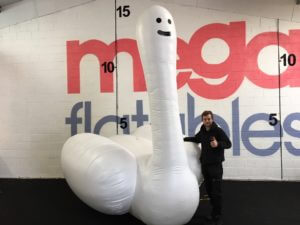 Man with giant sawn inflatable