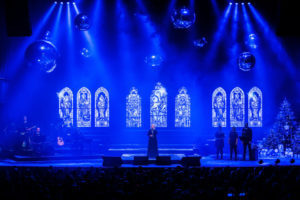 Blue lit inflatable chrome spheres at concert