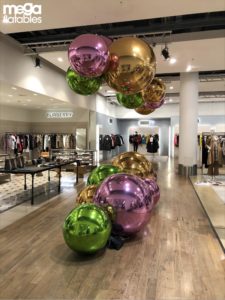 Store shop floor with large baubles.