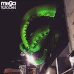 Giant inflatable squid on top of a building