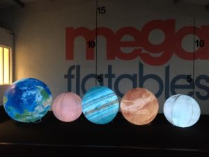 Space Inflatables for hire, Glowing Planet Inflatables by Megaflatables