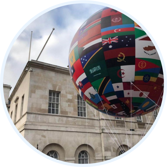 Inflatable globe with the worlds country flags on it